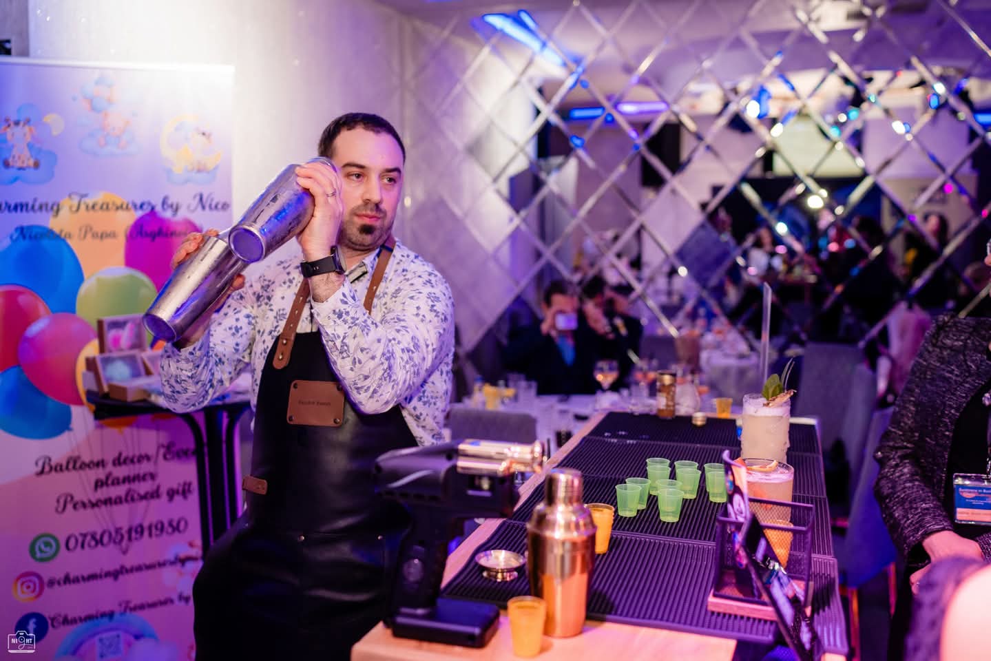 EscoBar Events bartender shaking a cocktail at a celebration